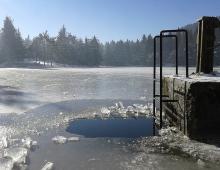 Epiphany, baptism and immersion swimming in an ice hole Ice hole for baptism as it is called